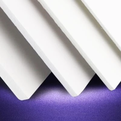 Stack of white PVC foam sheets showing consistent surface finish across a production batch Stack of white PVC foam sheets showing consistent surface finish across a production batch